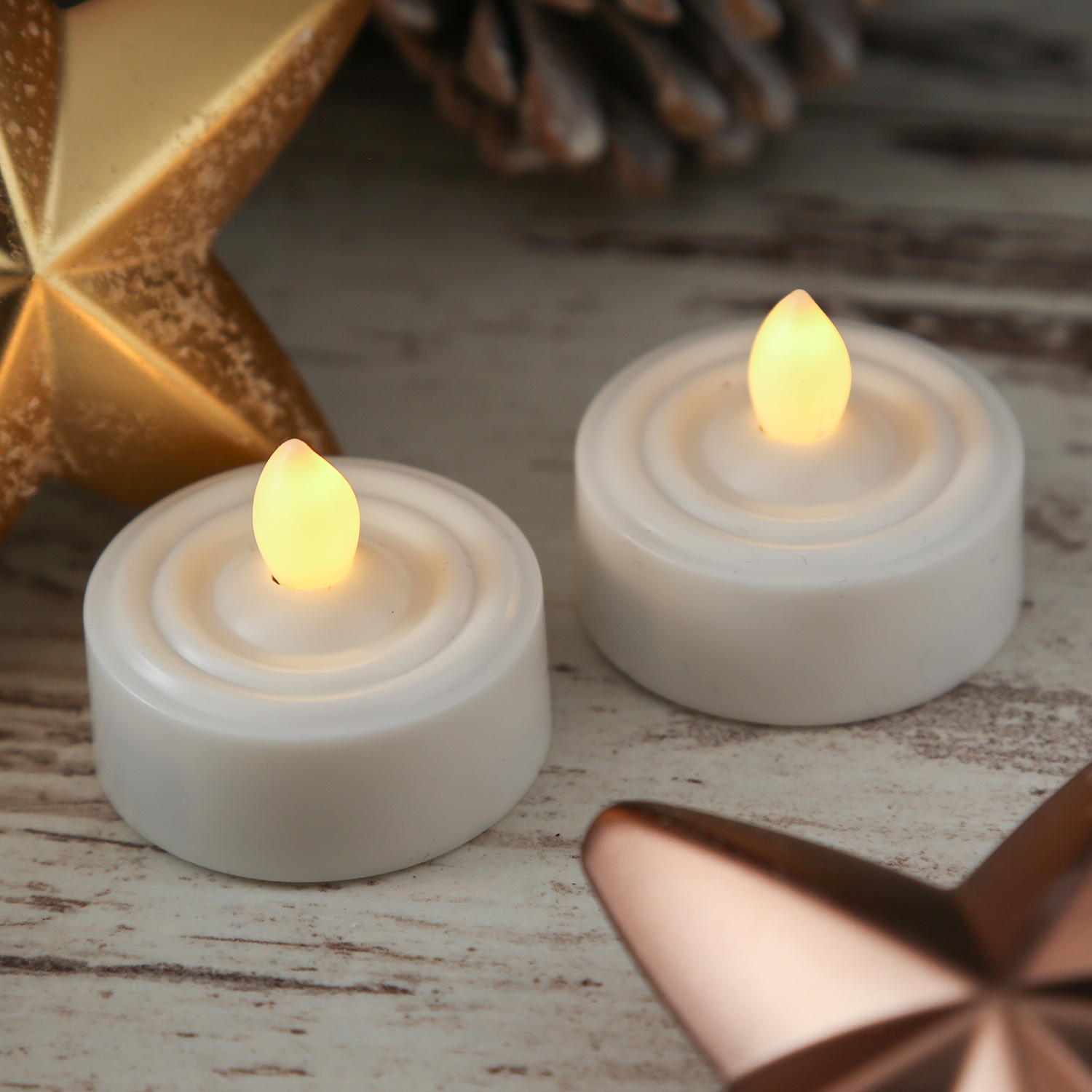 LED Teelicht 12er Set "Paulo" - warmweiße flackernde Flamme - Batteriebetrieb - Timer - H: 2,9cm LED Teelicht 12er Set "Paulo" - warmweiße flackernde Flamme - Batteriebetrieb - Timer - H: 2,9cm